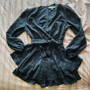 Black v-neck romper that looks like a dress. Long sleeve